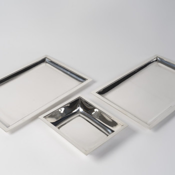 JEAN E. PUIFORCAT – Set of two rectangular platters and a bowl in solid silver, Art Deco period
