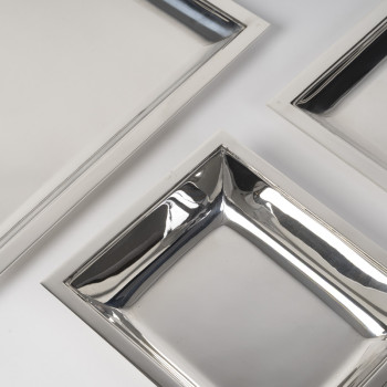 JEAN E. PUIFORCAT – Set of two rectangular platters and a bowl in solid silver, Art Deco period